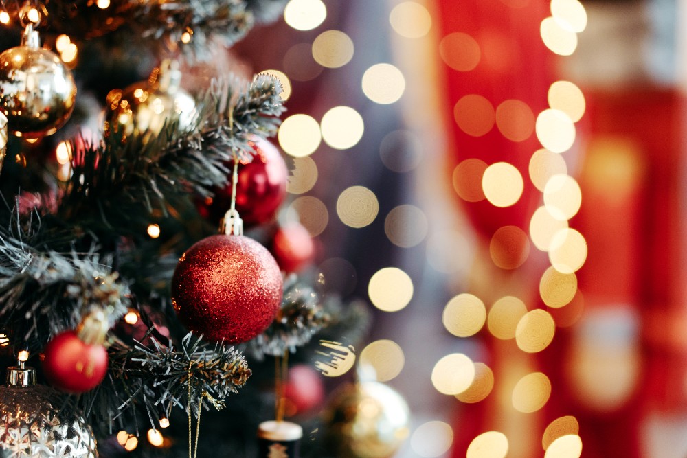 Christmas tree with faint lights in the background