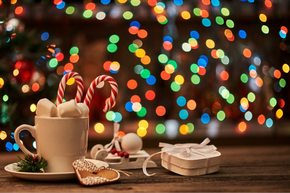 hot cocoa candy cane and Christmas lights