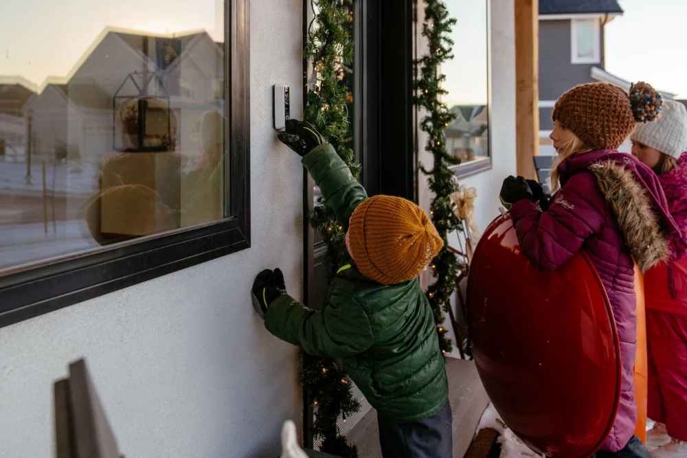 kids ringing doorbell in winter