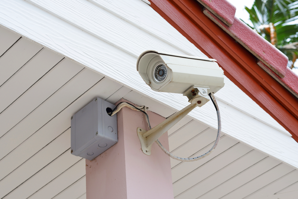 Outdoor security camera installed on a front porch.