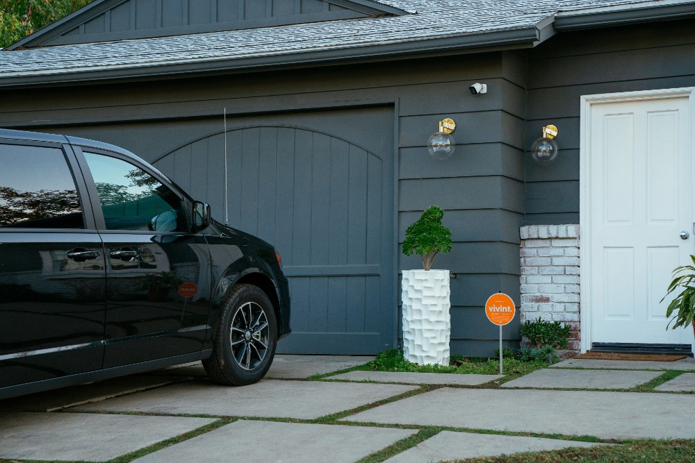 A car protected by Vivint Car Guard parked in the driveway.