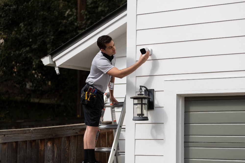 Vivint Smart Home Pro installing an outdoor camera.