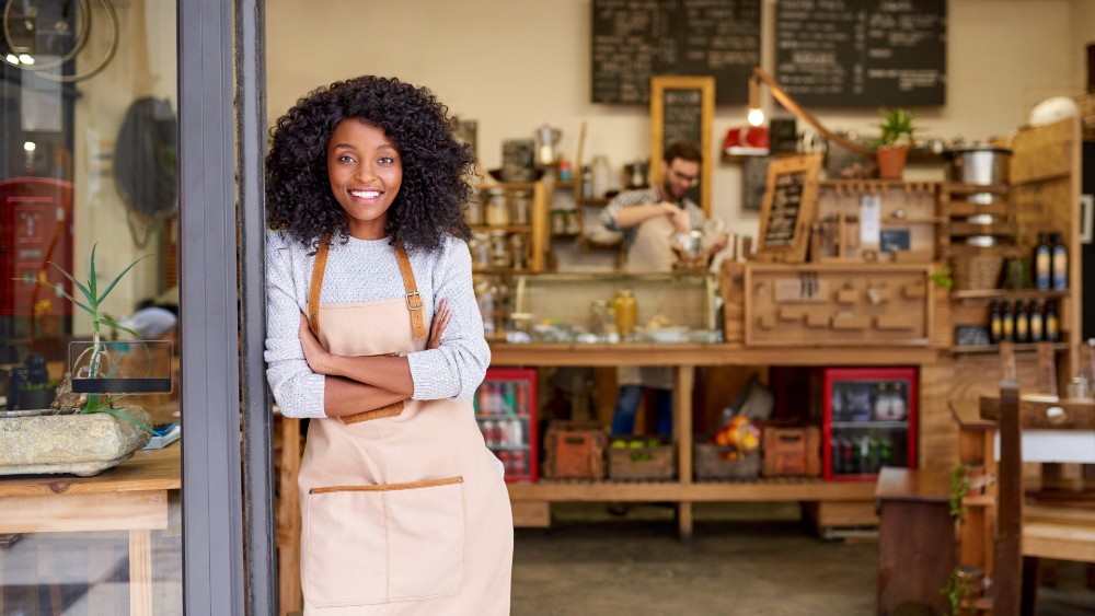 Small business order standing in business entrance.