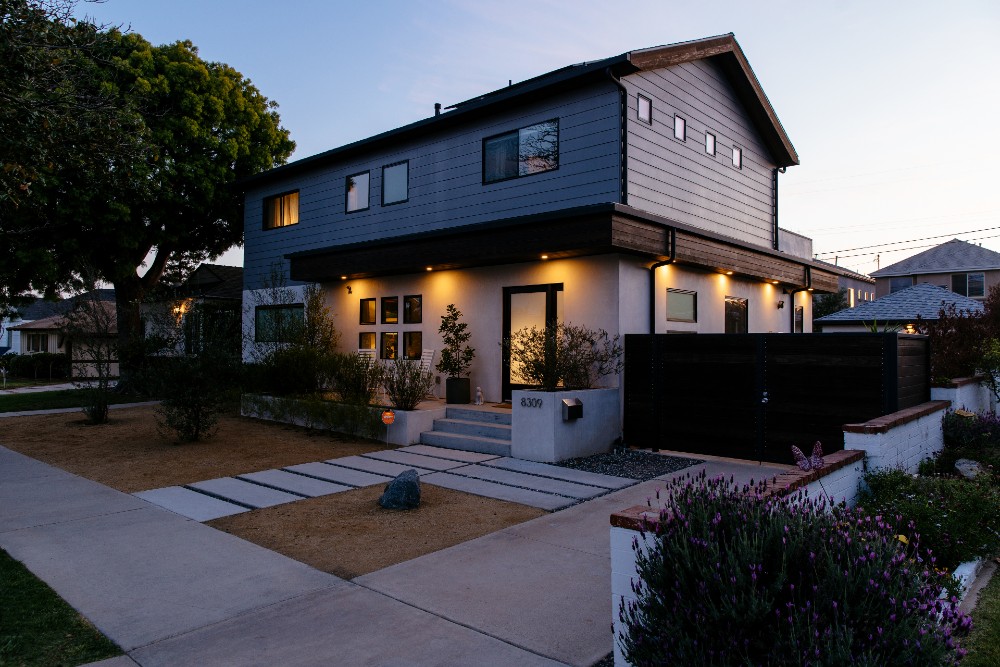 Home exterior with smart lighting at dusk.