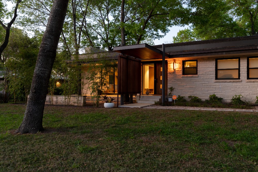 Home exterior with smart lighting at dusk.