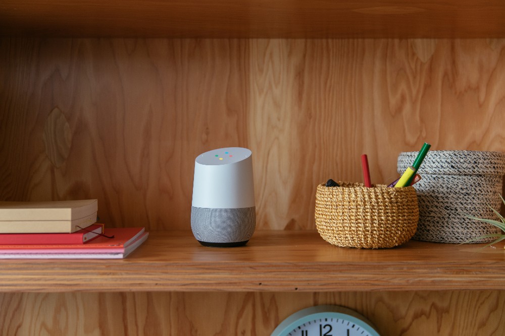 Google Home on living room book shelf.