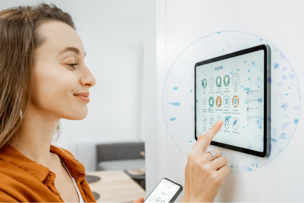 Woman clicking on her home security hub screen.