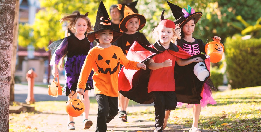 Kids in costume trick-or-treating.