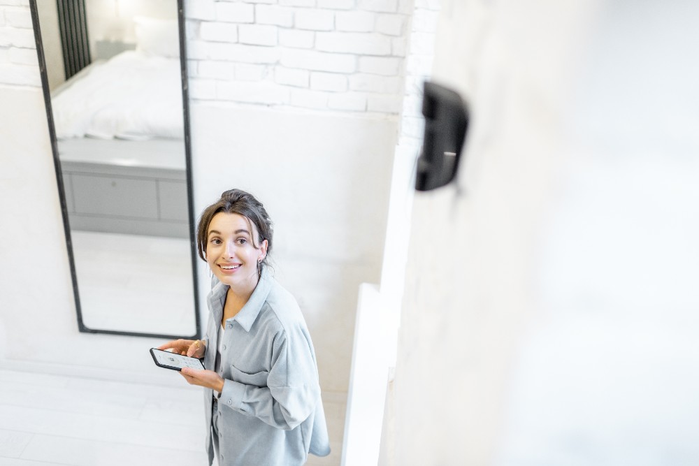 Woman walking by motion sensor in her house.