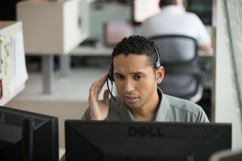 Vivint employee talking with a customer from the monitoring center.