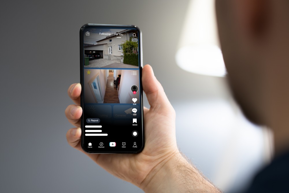 Person looking at their home security app.