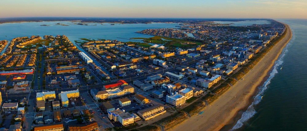 Wide aerial shot of Ocean City Maryland looking north at sunrise