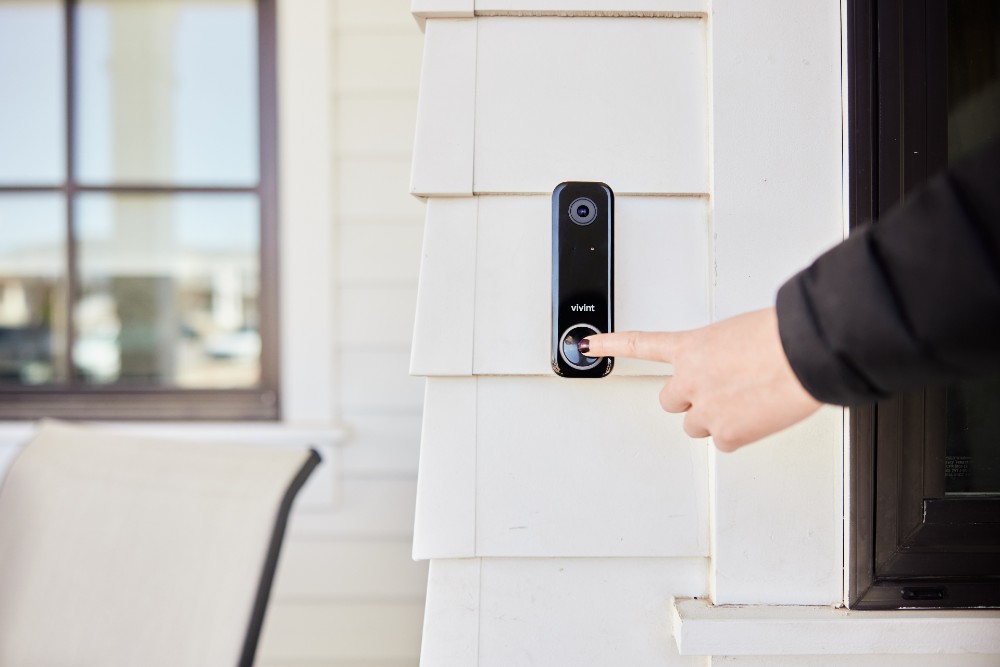 Person ringing Vivint Doorbell Camera Pro