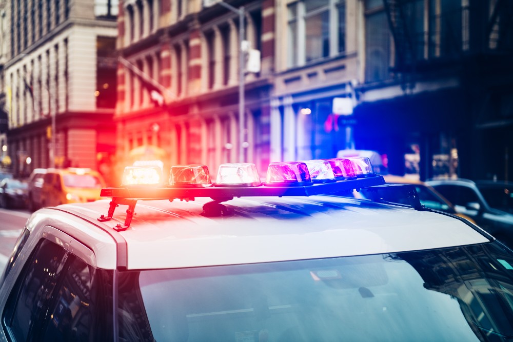 Police car with alarm and signal light flashes on the roof rush emergency call in NYC