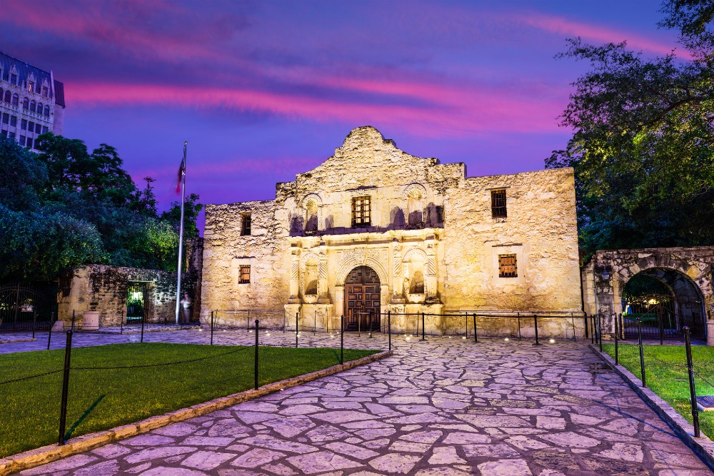 The Alamo in San Antonio Texas with purple pink skies