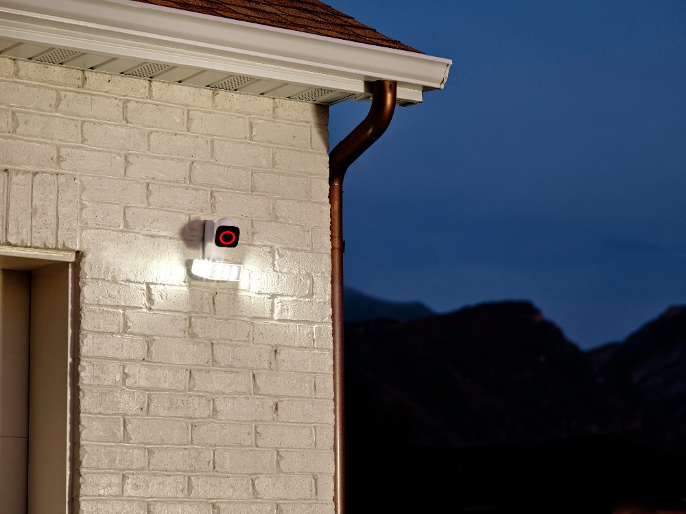 Vivint Outdoor Camera and Spotlight Pro on house with light