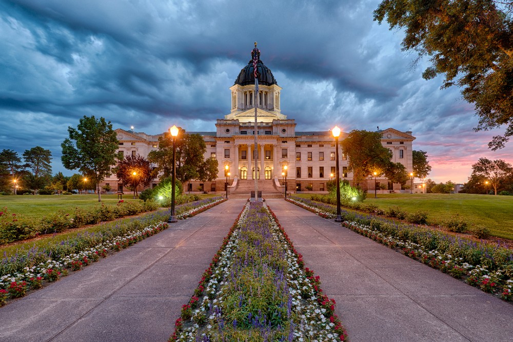 A storm rolls in at dawn at the South Dakota State Capitol building in Pierre, South Dakota