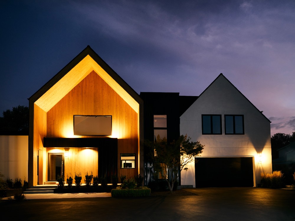 House illuminated by smart lighting at night.