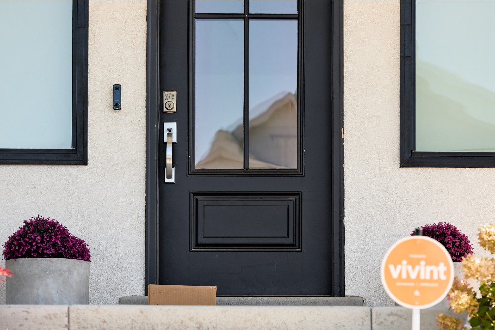 Packages on a front porch protected by the Vivint Doorbell Camera Pro.