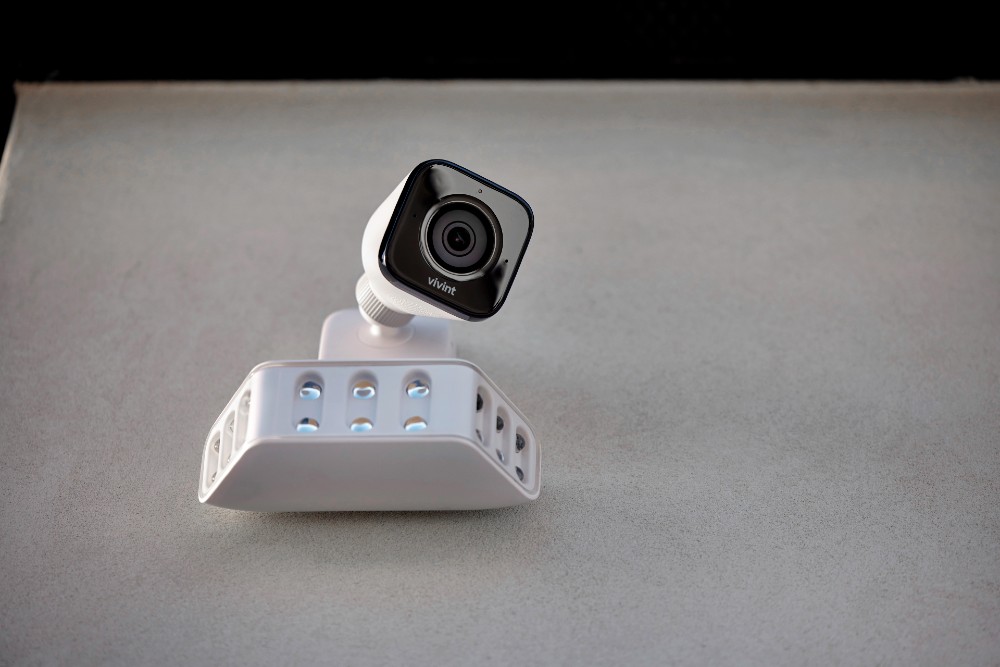 Vivint Spotlight Pro and Outdoor Camera Pro (Gen 2) monitoring a home's exterior.