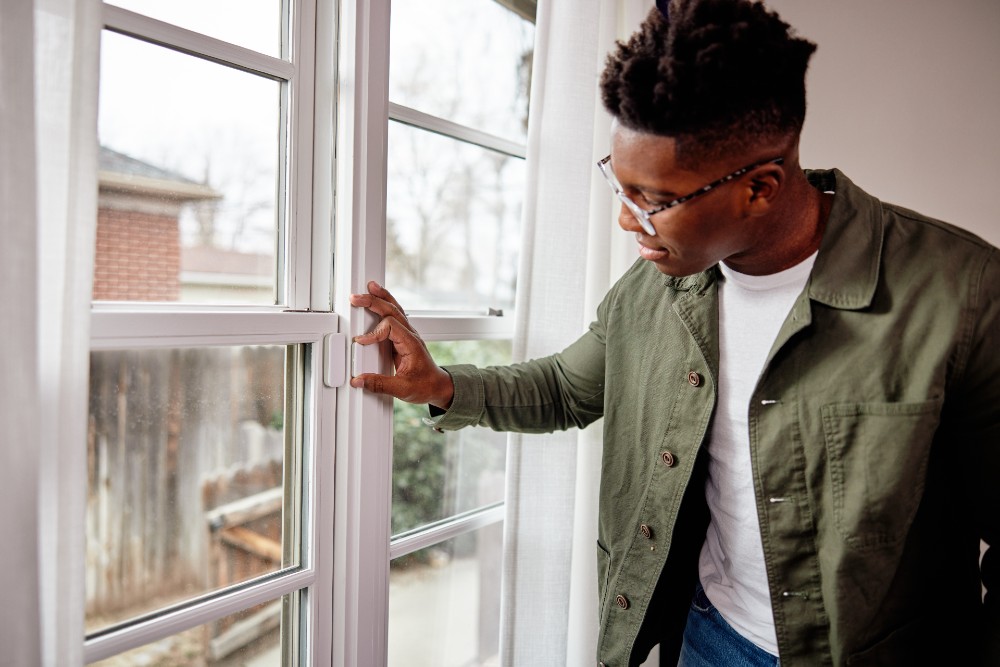 Man checking out his Vivint Window Sensor.