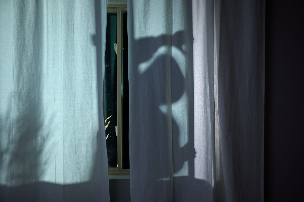 Lurker outside a home.