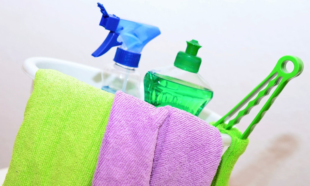 spring cleaning bucket of cleaning supplies