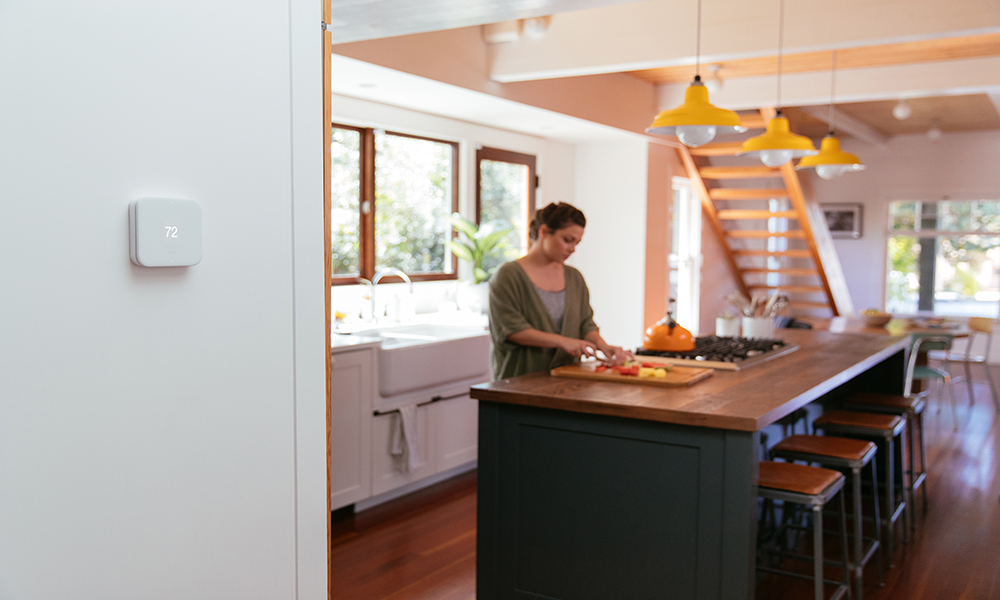 thermostat woman kitchen