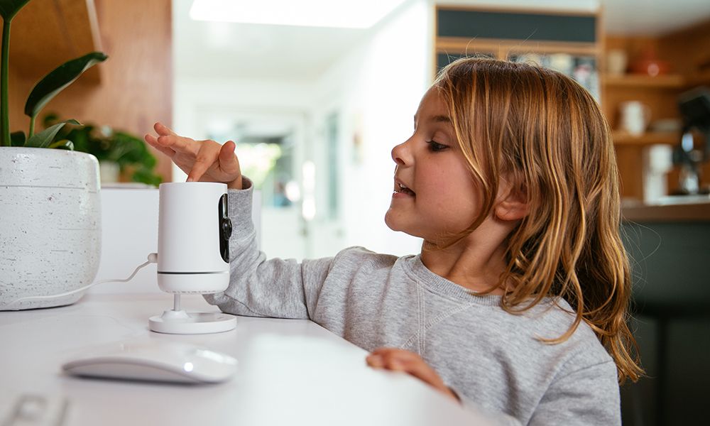 girl using indoor camera camera