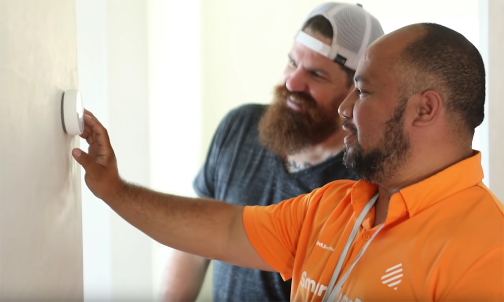 Vivint Pro explaining the Thermostat