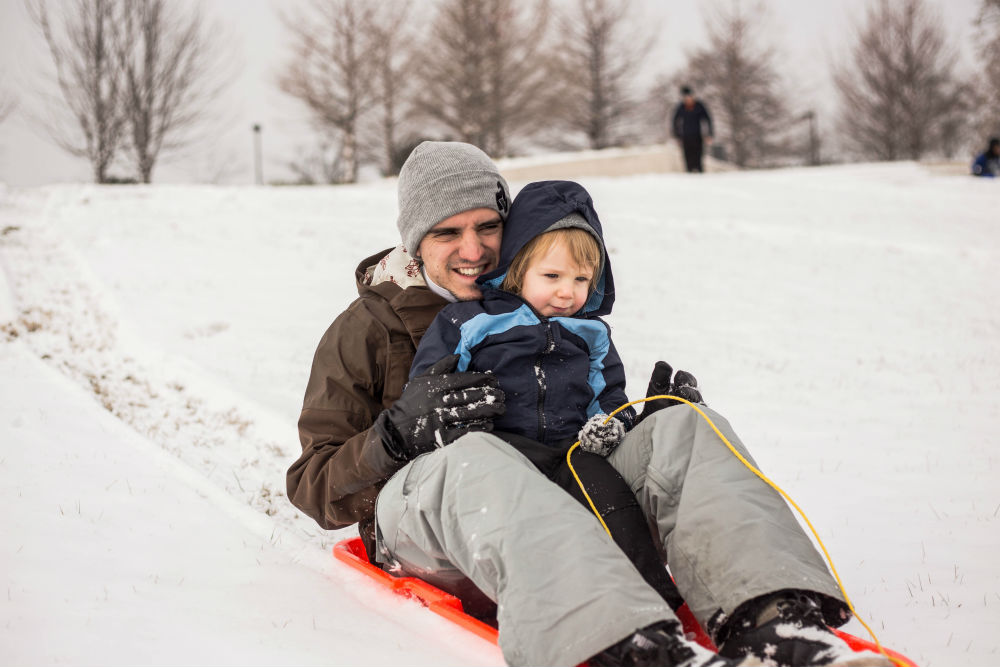 Dad and Son sledding