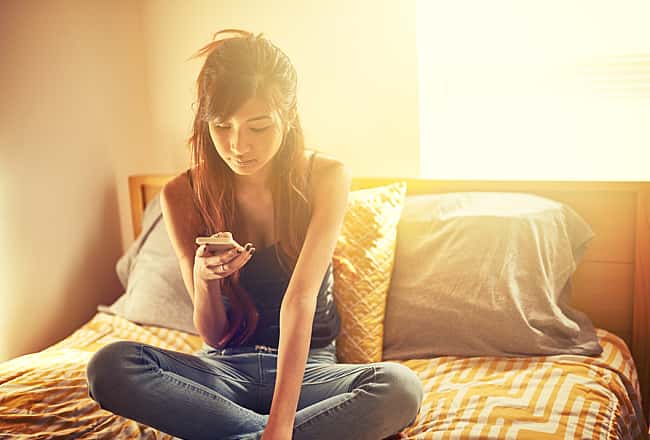 Teenager using a smart phone 