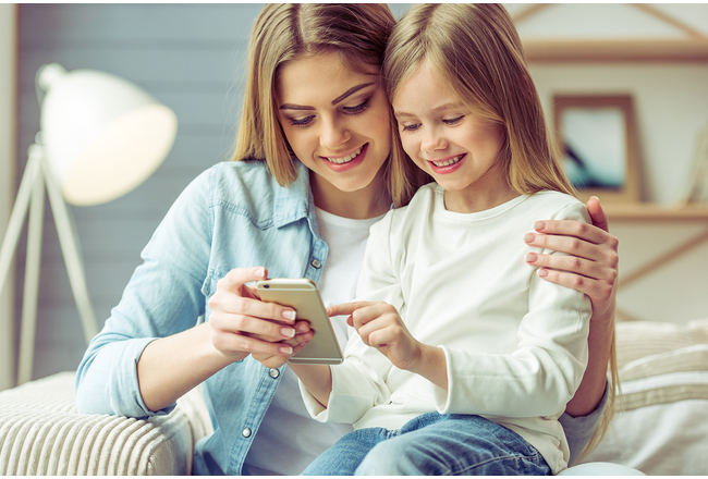 Mother and Child Looking At Cellphone 