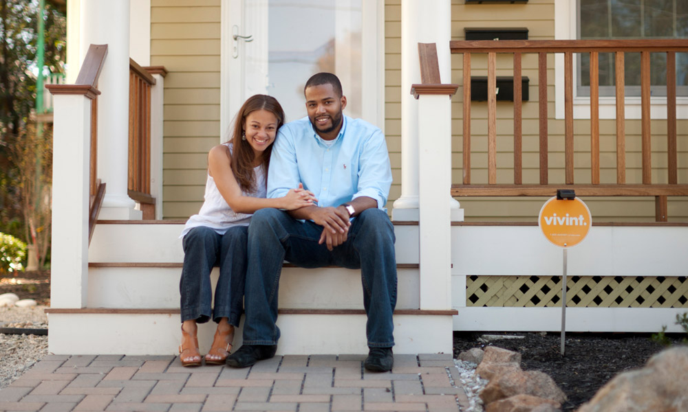 couple in front of house