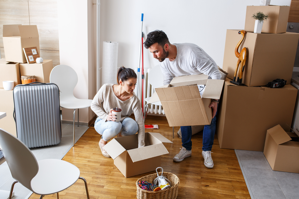 couple packing moving boxes