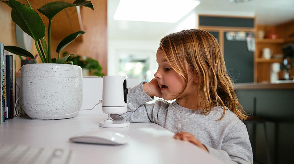 girl talking to indoor camera camera