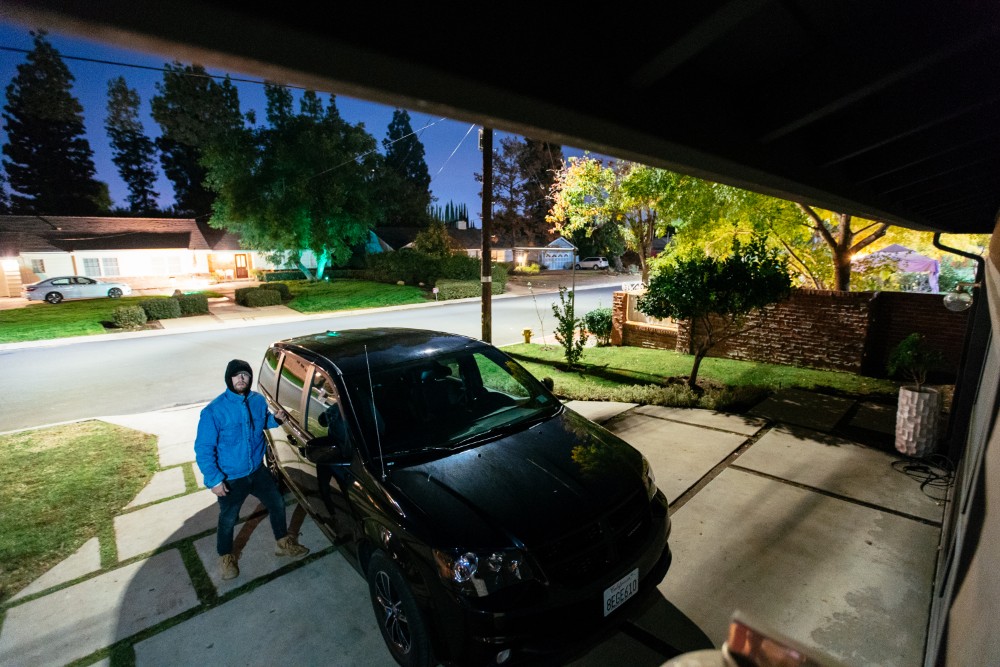 Man attempting to break into a car.