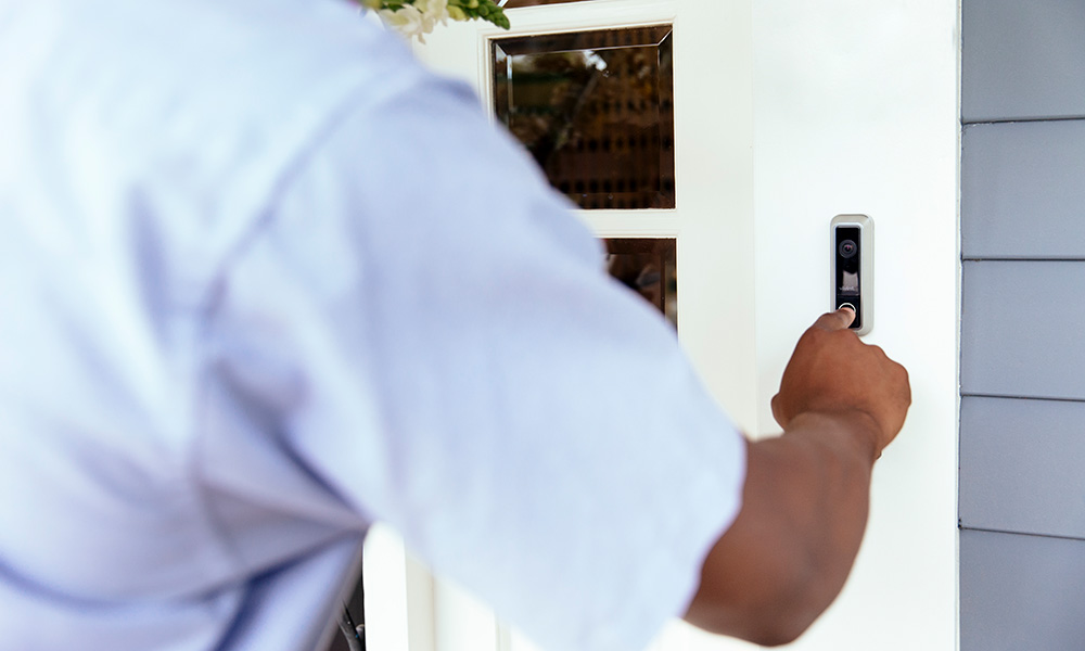 Delivery person ringing a Vivint doorbell camera