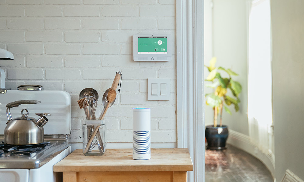 woman using amazon echo kitchen