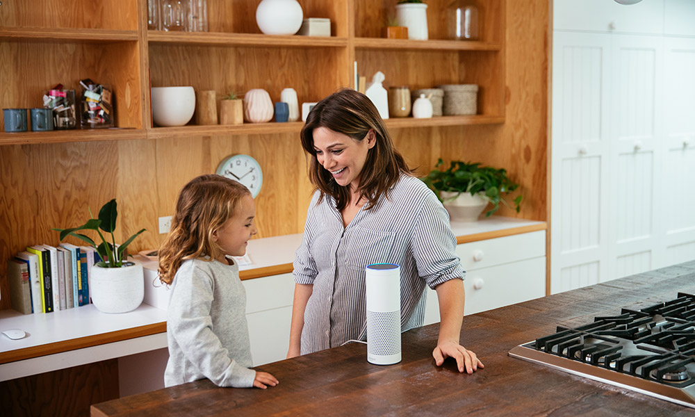 Amazon Echo smart speaker used by mom and daughter