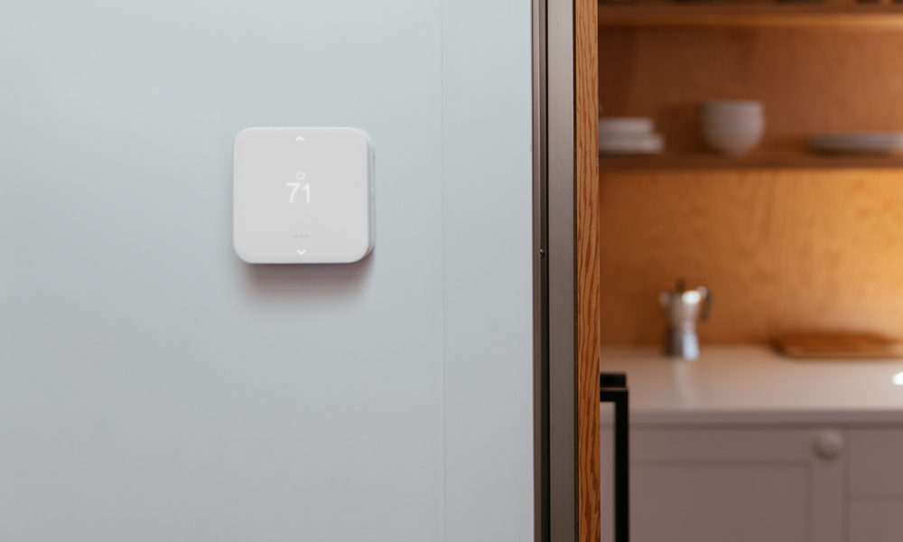 Vivint Smart Thermostat mounted on a wall