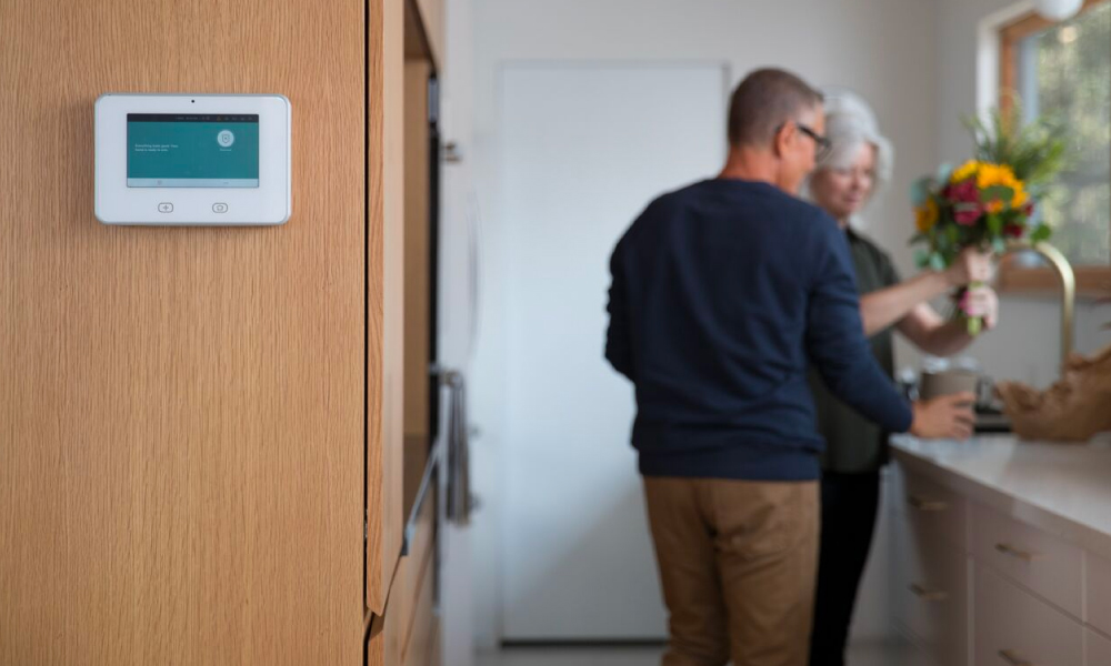 Vivint glance display monitor with senior couple in the background