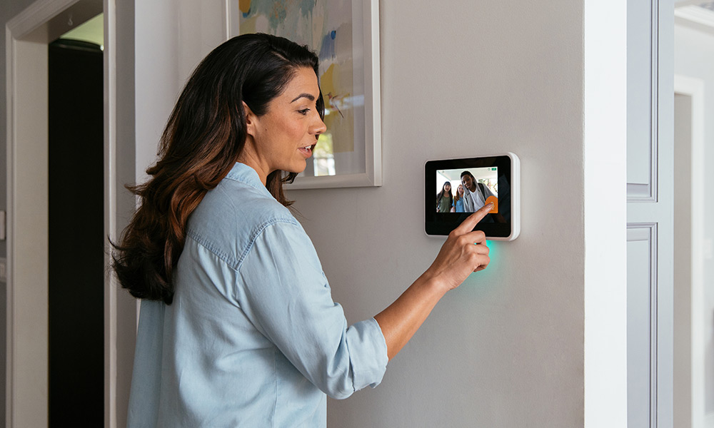 Woman interacting with her Vivint Smart Hub