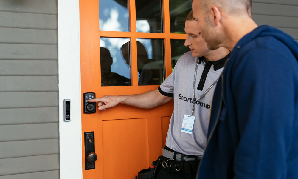 Vivint Professional showing how to use a Vivint smart lock and doorbell camera