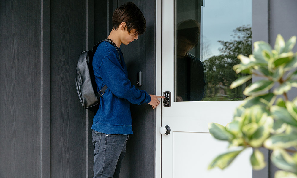 Teenager using the Vivint Smart Lock