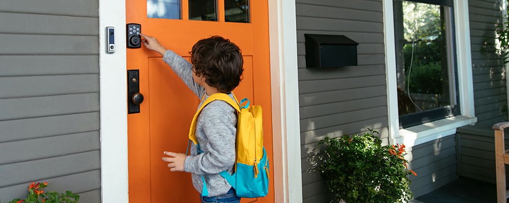 Child using the Vivint smart locks and Vivint doorbell camera