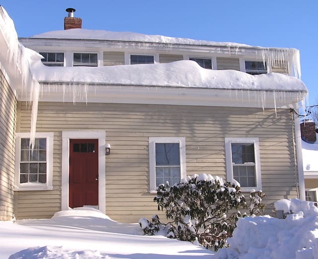 house covered in snow and ice